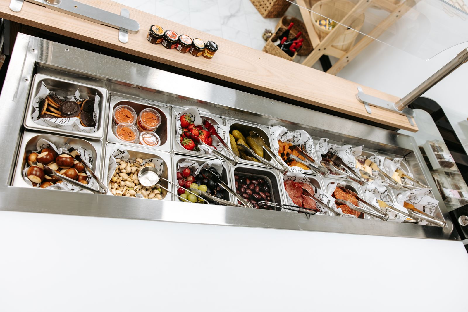 The build-your-own bar stocked with meats, cheeses, olives, nuts, and fruit